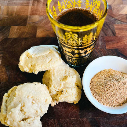 Sugar cookies baked with Mediterranean twist of "Coffee Break" spice blend. On the right, a small bowl with the coffee hawaij spice blend, and black Middle-Eastern coffee.