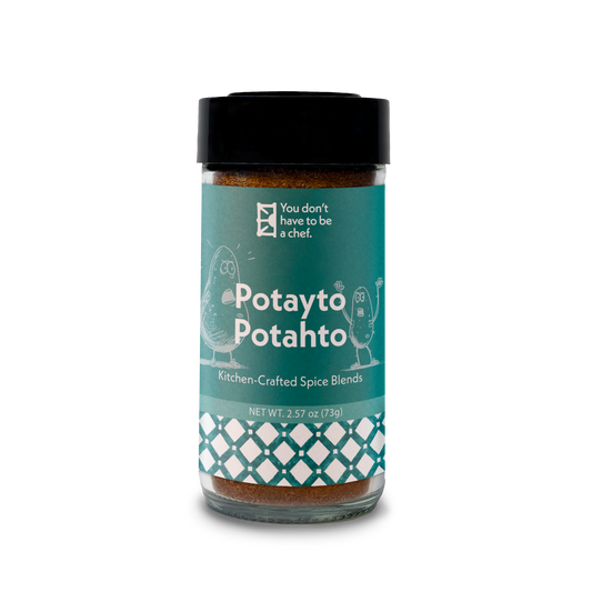 A bottle of Potayto-Potahto spice blend. A spice mix for roasted potatoes and vegetables with Mediterranean flavors.