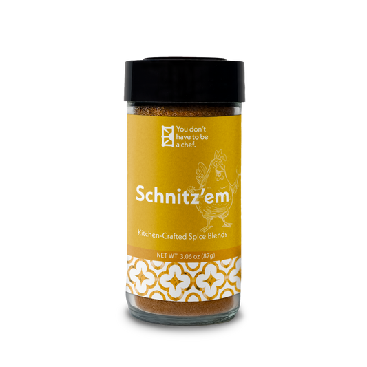 A bottle of Schnitz'em Mediterranean spice blend. 9 Middle Eastern spices for adding bold flavors to schnitzel, breaded chicken, or other fried dishes.