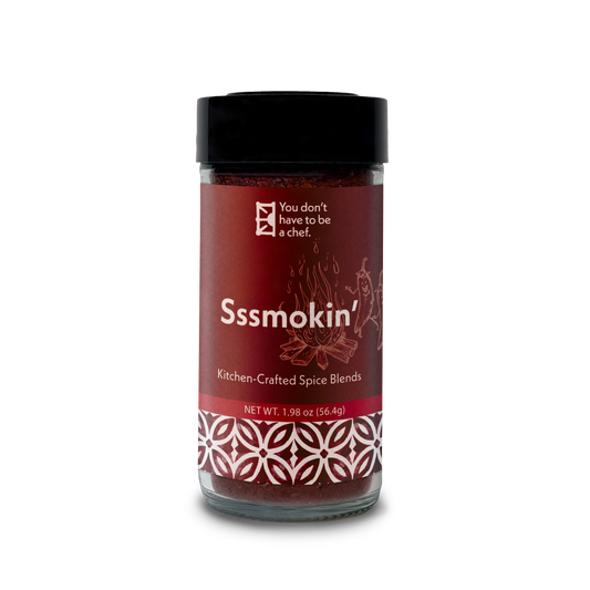 Bottle of Sssmokin’ spice blend. Mediterranean spicy and smoky blend of 5 peppers and spices. Ideal for ribs, wings, seafood, and adding heat to sauces.